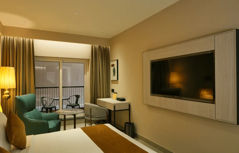 Modern amenities in Pride Room including minibar and Google TV - Best luxury hotels in Wayanad