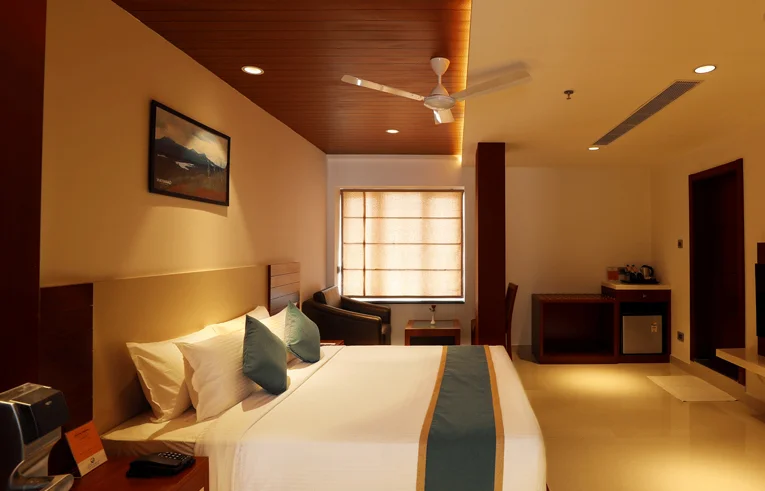 Comfortable seating area in Signature Room - Couple friendly hotels in Wayanad